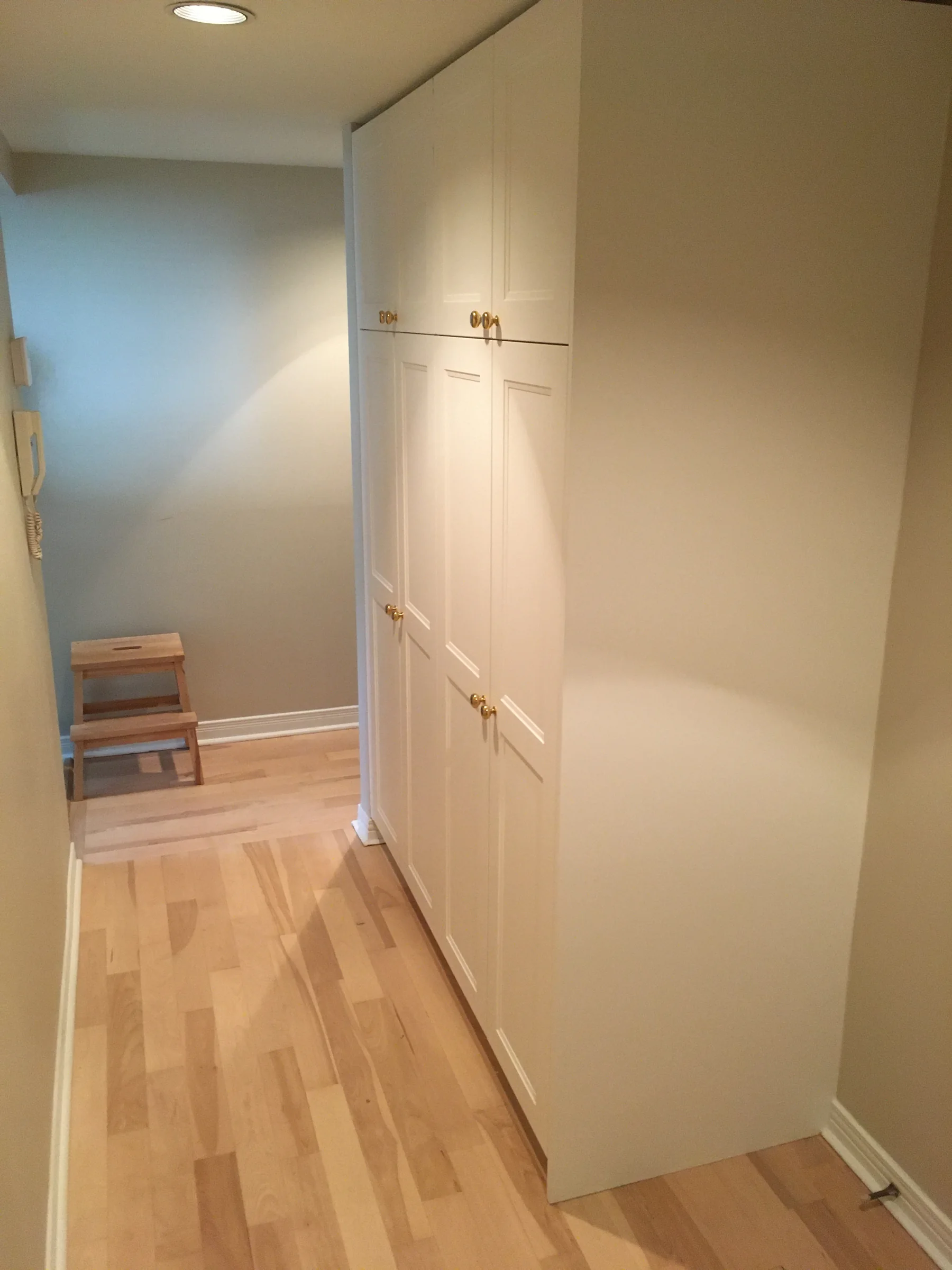 Floor-to-ceiling IKEA cabinetry finished with a full-depth fitted end panel